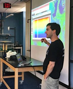 Matt Grossi explains ocean observation, marine technology, and CARTHE research to visiting high school students during an outreach event at the University of Miami Rosenstiel School of Marine and Atmospheric Science. (Photo credit: Laura Bracken)