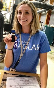Sydney Niles holds an oil sample at the 2018 National High Magnetic Field Laboratory open house. (Photo credit: Leda Eaton)