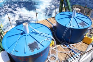 View of the back stern of the R/V Walton Smith during the RECOVER research cruise. Two 500-gallon tanks with life support systems served as recovery areas for mahi-mahi after being fitted with pop-up satellite archival tags. One tank was used for the oil-exposure experiment and the other was for the control group. Photo credit: RECOVER consortium.