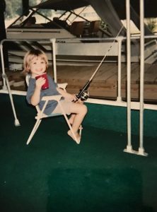 Nova Southeastern University master’s student Natalie Slayden as a child, fishing for catfish off a houseboat in Hopewell, Virginia. (Photo by Winnie Hinton)
