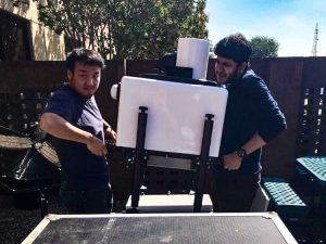 University of Texas at Dallas Ph.D. students Lu Zhan (left) and Yajat Pandya (right) deploy a Halo Photonics Doppler Wind LiDAR. (Photo credit: Matteo Puccioni)