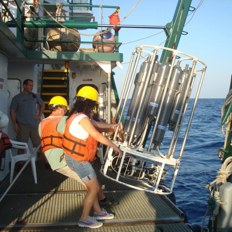 G Graduate student Malak Tfaily (FSU) and Dr. Wade Jeffrey (UWF) recover a Rosette sampler. (Photo credit: Jeff Chanton, FSU)