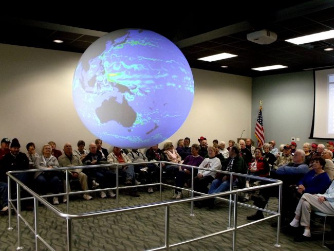 DROPPS_Photo-1-20-11_highres General public visitors attend a Science on a Sphere presentation at the Bay Education Center. (Photo by Jackie Hattenbach)