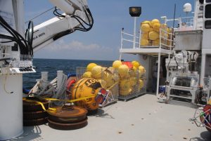 Monitoring and mooring equipment is staged on the deck of the RV Pelican for deployment. (Photo credit: Steve DiMarco)