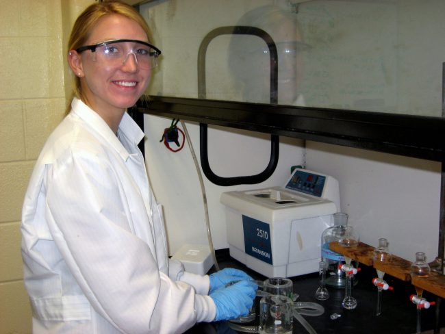 IMG_0795a_2 High school graduate Amy Olson extracts oil sample after exposure to simulated sunlight. Olson worked in UNO's 2012 summer outreach program for high school students and undergraduates. This GoMRI project will include both undergraduate and high school students in summer research on the effect of sunlight on oil compounds.