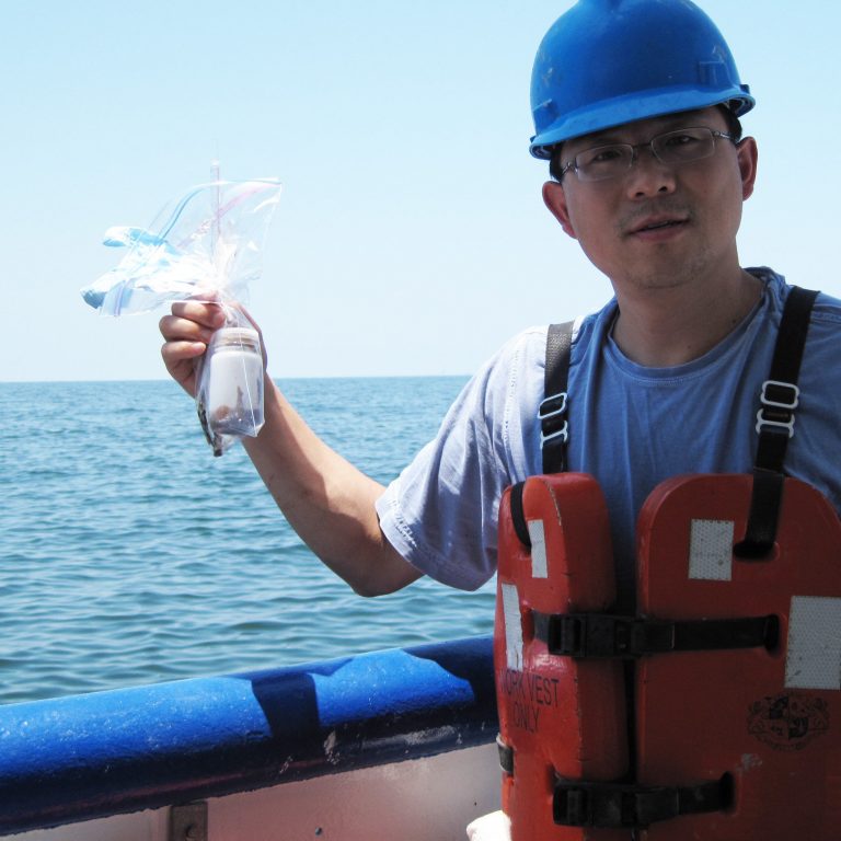 Liu_oilwatersample_IMG_1795 Dr. Zhanfei Liu (University of Texas at Austin) collected water samples in May 2010 in the northern Gulf of Mexico in areas affected by the Deepwater Horizon oil spill and used them to study the oil weathering process. (Photo credit: Z. Liu)