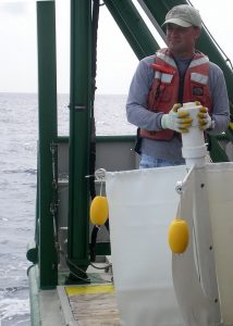 Dr. Tamay Özgökmen, Director of CARTHE, is on the deck of the University of Miami’s RV Walton Smith to deploy the last of 300+ custom drifters as part of the largest upper ocean dispersion experiment in the Gulf of Mexico to understand currents that move pollutants. (Photo by Dr. Bruce Lipphardt)