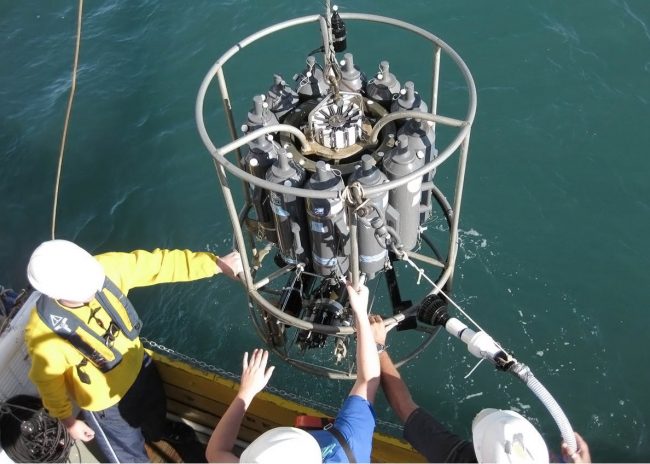 RFPII_Cai_CTDdeployment_image001 Dr. Cai and his research team on the RV Pelican deploy a CTD/Rosette water sampler to collect water samples in the Gulf of Mexico. (Photo provided by Wei-Jen Huang/UGA)