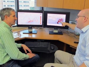 Professor Clint Dawson and researcher Casey Dietrich discuss ways to improve the modeling of surface oil transport into the beaches of Mississippi and Louisiana. Dawson and Dietrich are members of the CARTHE. (Photo provided by Cas