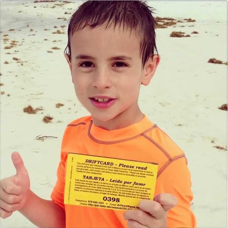 driftcard_gigem_boy A young boy found a driftcard while swimming at Santa Rosa beach, FL. His mother sent this message, “What a fun surprise since my husband and I are both former aggies….Our son loved it!!” (Photo courtesy of Amber C and GISR)