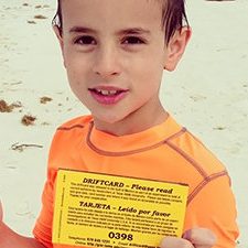 A young boy found a driftcard while swimming at Santa Rosa beach, FL. His mother sent this message, “What a fun surprise since my husband and I are both former aggies….Our son loved it!!” (Photo courtesy of Amber C and GISR)