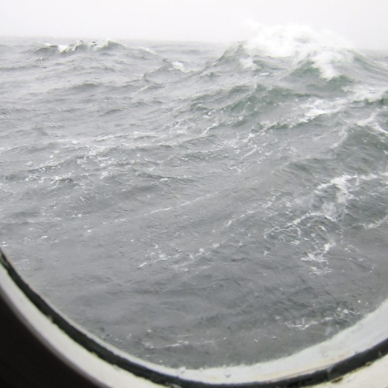 6-hires-WEB Breaking surface waves, generating whitecaps and ocean turbulence as seen from a ship's bull's eye. (Photo by: Kai Christensen)