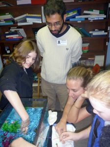 FSU researcher Arvind Shanthram looks on as students test the design of their plankton model. (Photo credit: Amelia Vaughan)