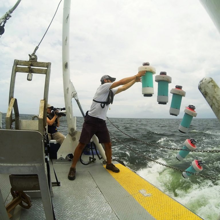 Conor Smith is shown here in a time lapse photo of one CARTHE drifter being deployed from the R/V Acadiana near the site of the Hercules rig. (Photo courtesy of CARTHE)