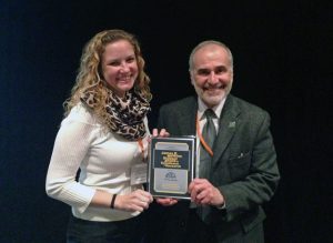 Emily Henkel accepts the 2014 Watkins Award from Dr. Robert Gagosian.