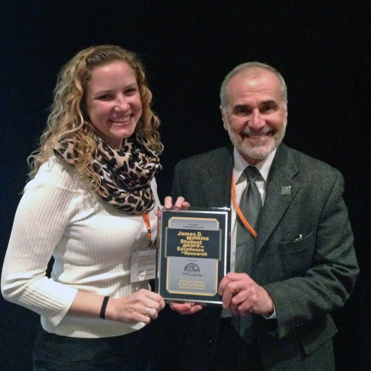 2014-GoMRI-Conference-Watkins-Award Emily Henkel accepts the 2014 Watkins Award from Dr. Robert Gagosian.