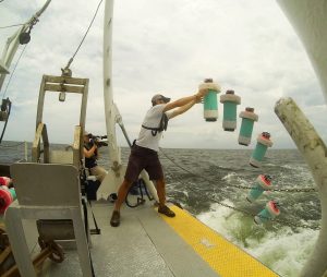 Conor Smith, a graduate student at the University of Miami and a member of CARTHE, is shown here in a time lapse photo of one CARTHE drifter being deployed from the R/V Acadiana near the site of the Hercules rig. Data from these GPS-tracked drifters provides fast and accurate surface flow data to modelers and responders. (Photo courtesy of CARTHE)