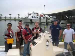 Researchers from the University of Texas Marine Science Institute, Texas Tech University, and Texas A&M-Galveston in addition to a member of the Coast Guard return from sampling the Galveston Bay oil spill. (Photo provided by DROPPS)