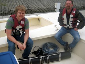 Working with the DROPPS team, students James Lassmann and Larry Brock from Texas Tech University return from their first sampling experience in Galveston Bay. The 3D holography unit is below them in the boat. (Photo provided by DROPPS)