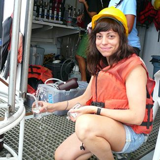 Alex Harper collects seawater samples from CTD Rosette Niskin bottles aboard R/V Weatherbird II. (Photo credit: Natalie Geyers)