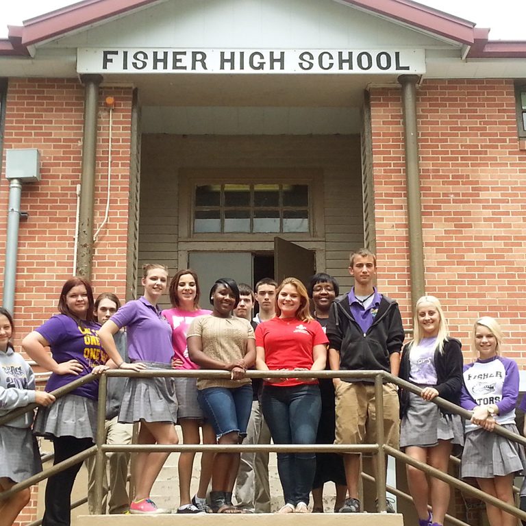 At the top center rail, undergraduate students Karry Wright (L) and Mary Osetinsky (R) gather with Jones’ high school science class in Lafitte, Louisiana. (Photo by Bennetta Horne)