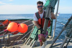 Postdoctoral researcher Patrick Schwing collects sediment cores in the Gulf of Mexico. (Picture by David Levin at Living on Earth)