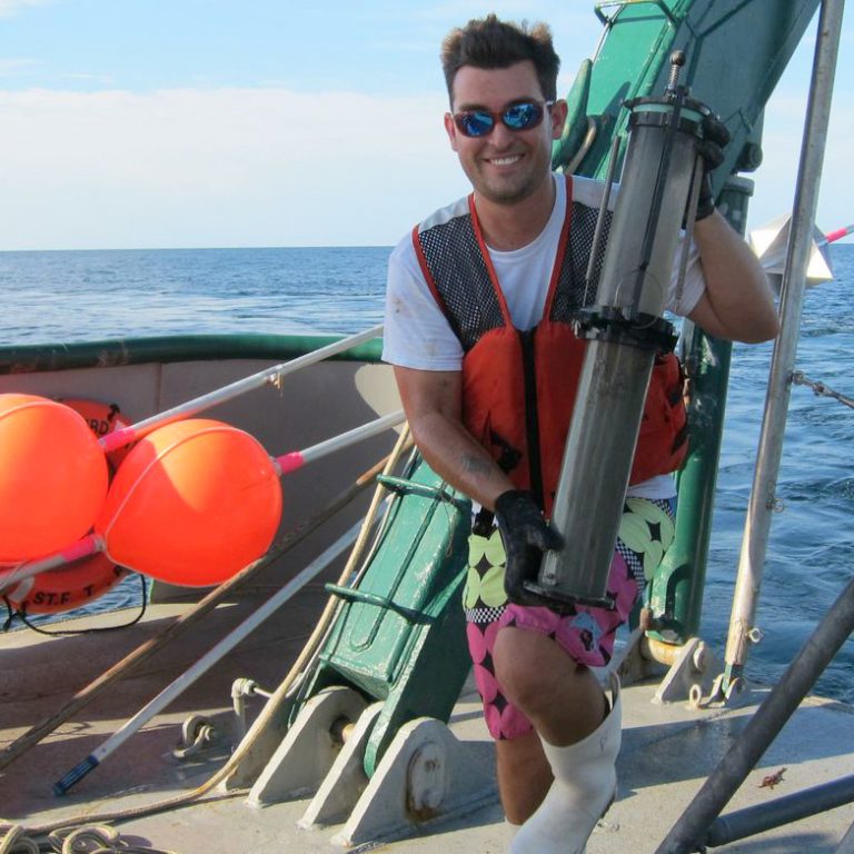Postdoctoral researcher Patrick Schwing collects sediment cores in the Gulf of Mexico. (Picture by David Levin at Living on Earth)