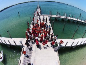 A drone’s perspective of the Jones Crew 22 campers as they gather to board a research vessel and tag sharks. (Photo provided by CARTHE)