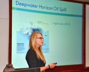 Graduate students gave conference-style presentations about their research while audience members wrote specific comments and suggestions on individual feedback cards. Here, University of North Florida student Arianne Leary discussed tracking oil across the Gulf. (Photo by: Eric Chassignet)