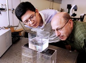Dr. Howard Stone (right), the Donald R. Dixon '69 and Elizabeth W. Dixon Professor of Mechanical and Aerospace Engineering at Princeton University, and gradute student Jie Feng (left) observe bubbles in a tank. (Photo credit: Frank Wojciechowski, Princeton University)