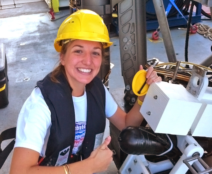 CarolineJohansen_img_1713-cropped-FEATURED Graduate student Caroline Johansen is happy to have the video time-lapse camera back on the R/V Falcor after a deep-sea deployment. She will analyze the data it collected near a natural seep. Image credit: Mauricio Silva with the Schmidt Ocean Institute.