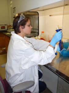 Sarah transfers DNA samples from single-cell organisms in the lab at University of West Florida. (Photo credit: Richard Snyder)