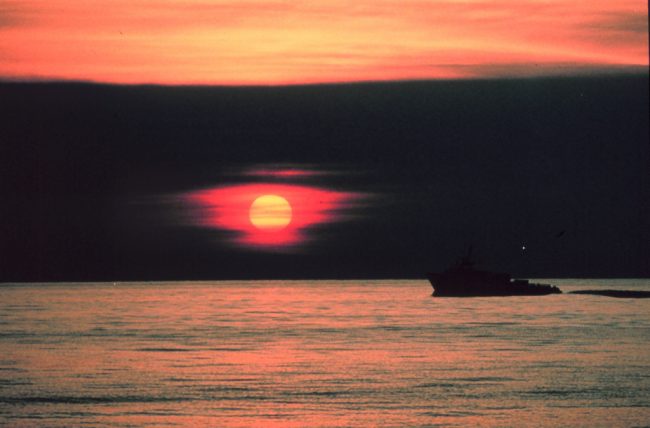 FromNOAApictureLibrary_line0043 A gulf crew boat silhouetted in a Gulf of Mexico sunset. Offshore of Cameron, Louisiana. (Photo by: Commander Grady Tuell, NOAA Corps