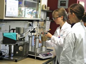 Drs. Martina Schedler and Ana Gabriela Valladares Juárez (far right) with the Hamburg University of Technology conduct bacterial experiments with high-pressure reactors. (Photo provided by Rudolf Müller)