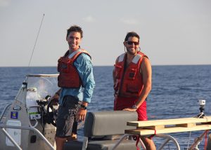 Conor and UM researcher Guillaume Novelli (right) celebrate the end of a long day recovering and redeploying drifters. On this day, they tracked one hundred drifters, recovered their GPS data, and released them back into the water. (Photo credit: David Nadeau)