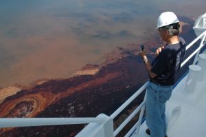 Southern Miss Marine Science Professor Vernon Asper documents the oil spill seen on the surface of the Gulf waters a few days after the Deepwater Horizon explosion. (University Communications photo)