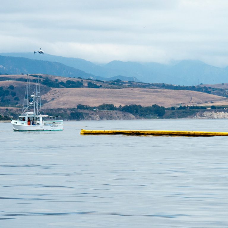 NOAA_Clean-up-using-boom-operations-FEATURED Crews clean-up the oil using boom operations off the coast of Goleta, Calif., May 21, 2015. The clean-up operation for the spill began the evening of Tuesday May 19, 2015. (U.S. Coast Guard photo by Petty Officer 3rd Class Andrea Anderson)