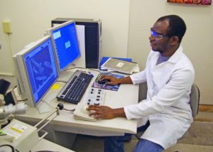 Sehinde conducts room temperature imaging of halloysite nanotubes with magnetic materials on the surface. (Photo by Chike Ezeh)
