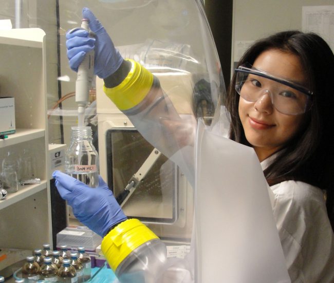 Boryoung Shin works in an anaerobic chamber at the Kostka Lab at Georgia Tech. (Photo credit: Max Kolton)