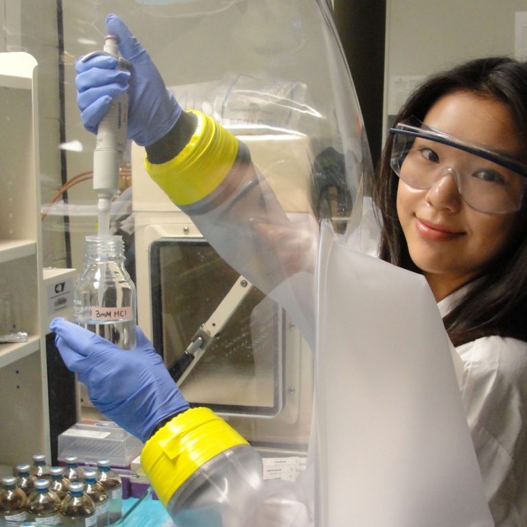 Boryoung Shin works in an anaerobic chamber at the Kostka Lab at Georgia Tech. (Photo credit: Max Kolton)