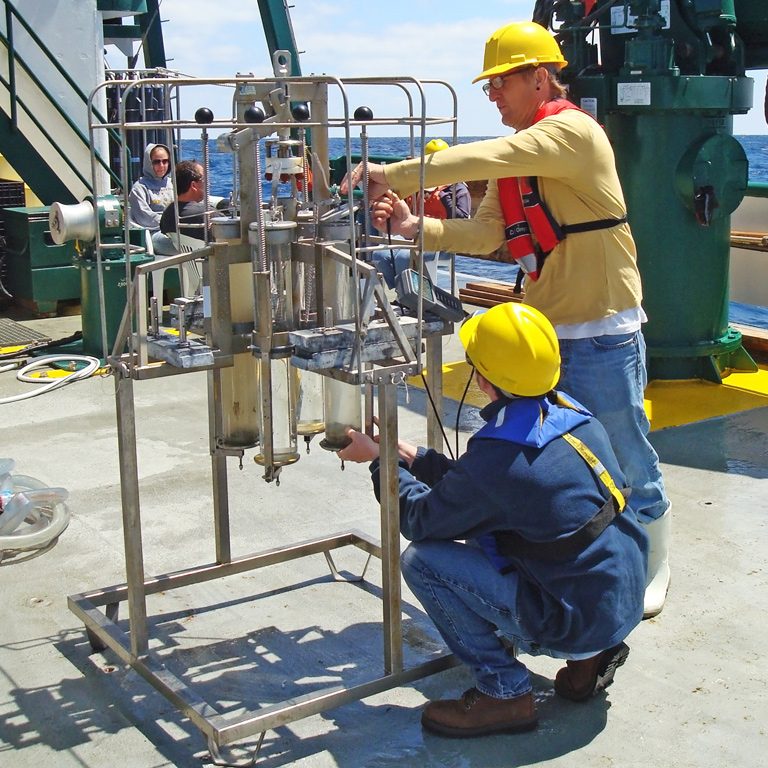 Chanton_MulticoreSamples_DSC02867 Florida State University graduate students Brian Wells and Brian DeSanti prepare to collect multicore samples on the deck of the RV Weatherbird II. (Photo by Jeff Chanton)