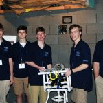 The team from James Clemons High School pose with their ROV. They received first place in the competition’s Navigator Level. (Photo credit: Tina Miller-Way)
