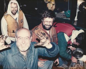 Farrington (bottom left) aboard the R/V Moana Wave sediment sampling cruise in July 1987. The team is quite happy after recovering a “near perfect” box core at about 150 meters depth south of Peru at midnight. (L-R) Dr. Ed Sholkovitz (WHOI), Farrington, Dr. John Volkman (CSIRO, Hobart, Tasmania, Australia); and Dr. Mark McCaffrey (then a MIT/WHOI Joint Program graduate student collecting samples for his Ph.D. dissertation research). (Photo credit: C. H. Clifford)