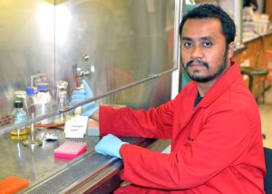 Nihar works at the UL Lafayette Biology Department in the Chistoserdov Lab under the hooded ventilation system to quantify PAH dioxygenase gene expression. (Photo credit: Suchandra Hazra)