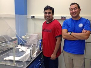 Subham Dasgupta (left) and Irvin Huang (right) used this glove box to create hypoxic conditions for this study. (Photo provided by Anne E. McElroy)