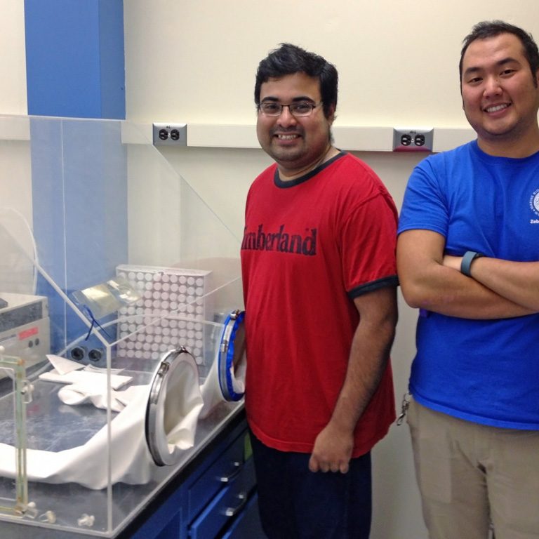 RFP-II-Dasgupta_IrvinSubhamGloveBox-web Subham Dasgupta (left) and Irvin Huang (right) used this glove box to create hypoxic conditions for this study. (Photo provided by Anne E. McElroy)