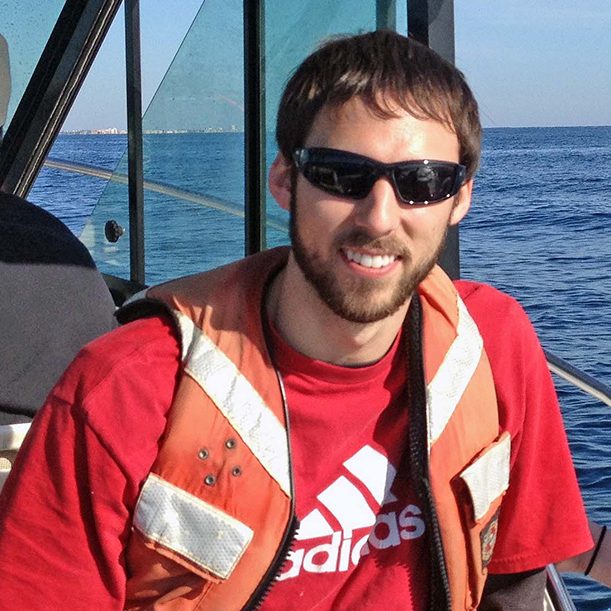 Bryan traveled to a Florida Strait sampling site to collect bacteria. He analyzed these samples to identify differences between microbial communities in the sea surface microlayer and underlying subsurface water. (Photo credit: Alexander Soloviev)