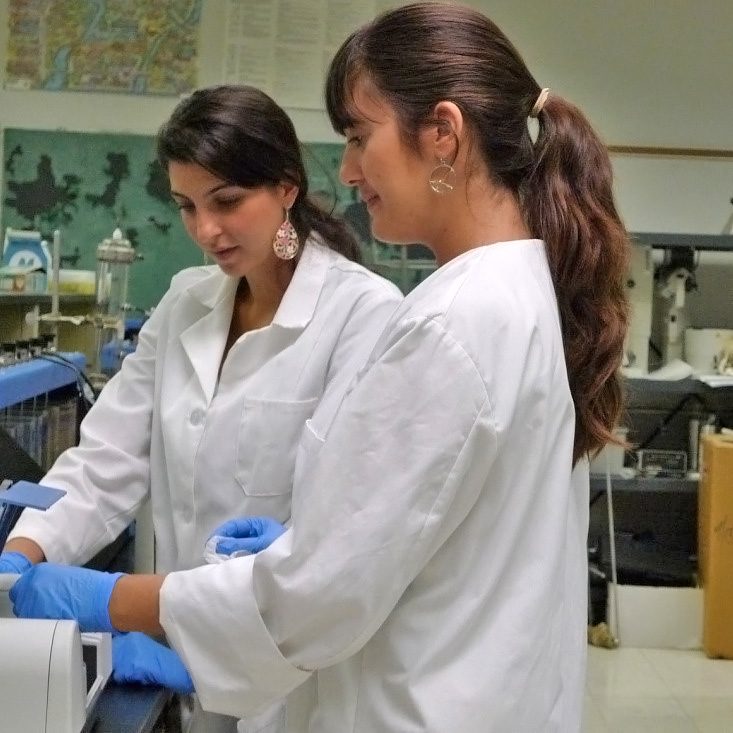 TanselPub_Mangroves_StudentWorkers-WEB Urpiana Koklonis (MS student) and Jillian Berbakov (undergraduate student) conduct calibration tests for the dispersant-oil mixtures in this study. Florida International University, Water Quality Laboratory, Engineering Center, Miami, FL. (Photo by Berrin Tansel)