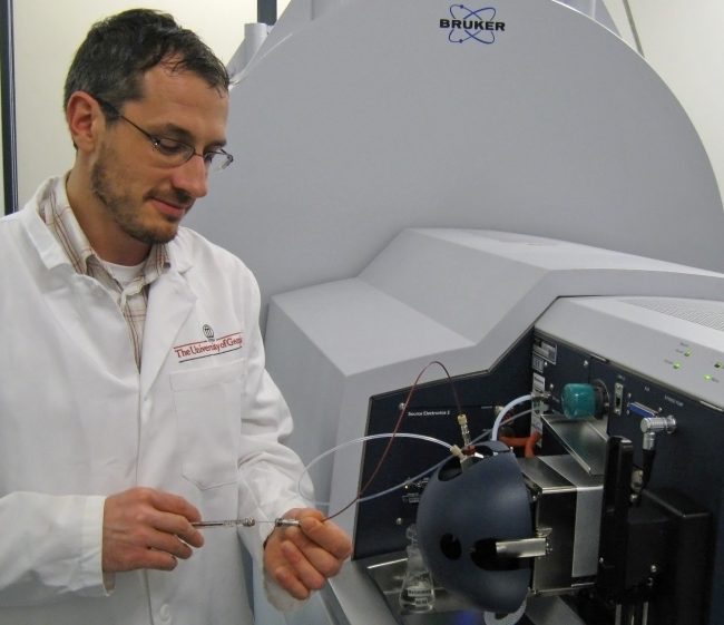 ECOGIG_SeidelUsingMasSpectrometer Dr. Michael Seidel (University of Georgia) injects a sample into an ultrahigh resolution mass spectrometer located in Oldenburg, Germany. The instrument identified the individual oil- and dispersant-derived compounds within the many dissolved organic molecules that are naturally present in Gulf of Mexico seawater. (Photo by Michael Seidel)