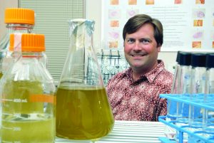 Dr. Michael Parsons in his Florida Gulf Coast University laboratory where he conducted microscopy analyses of phytoplankton. (Photo provided by M. Parsons)